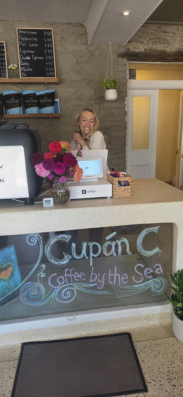 Celine behind the counter at Cupán C, Bunmahon