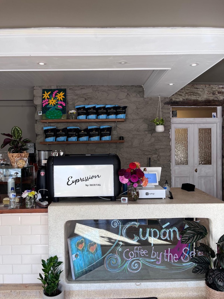 Coffee counter at Cupán C with bags of Pónaire coffee