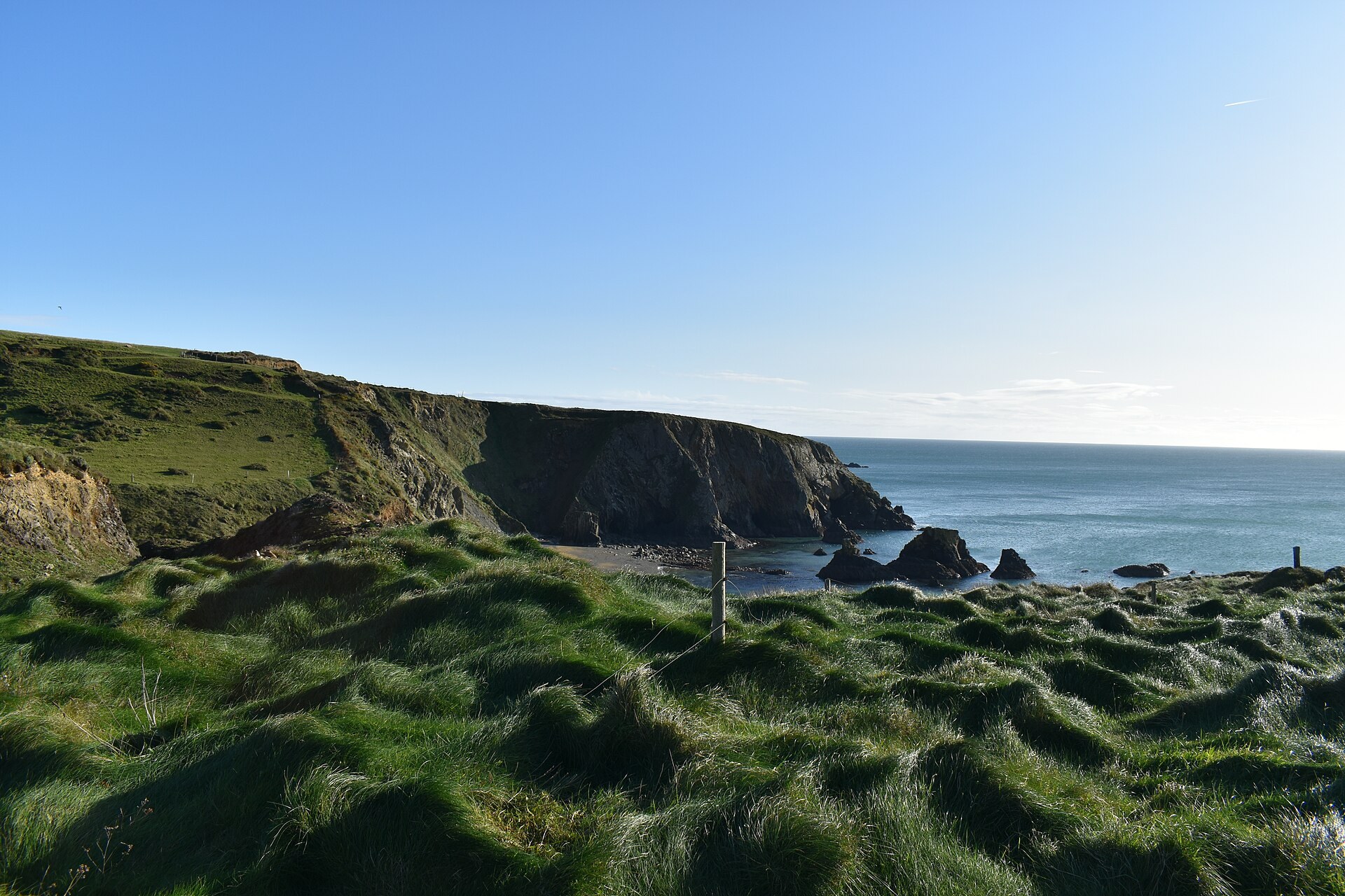 Green headland and sea stacks on the Copper Coast near Bunmahon